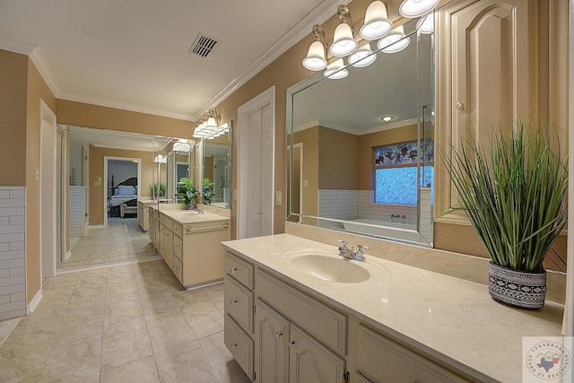 bathroom with tile patterned floors, vanity, a bathtub, a notable chandelier, and crown molding