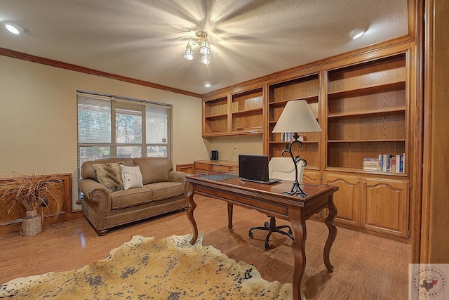 office with a textured ceiling, light hardwood / wood-style flooring, and ornamental molding