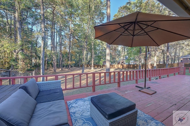 wooden terrace featuring an outdoor hangout area