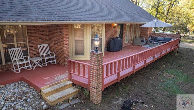 wooden deck featuring outdoor lounge area and area for grilling