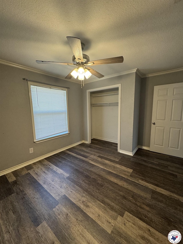 432 Carrol Ave, Wake Village, TX 75501 - unfurnished bedroom with a textured ceiling, dark wood-style flooring, crown molding, a closet, and ceiling fan