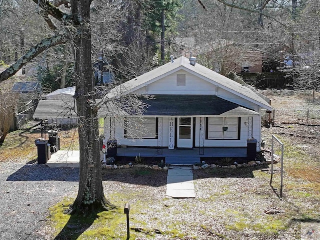 bungalow with a shingled roof and a porch