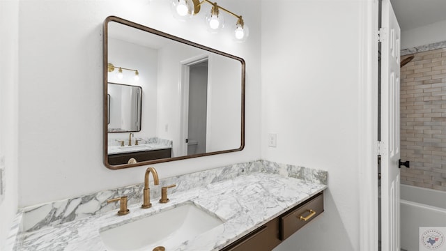 bathroom featuring a bathing tub and vanity