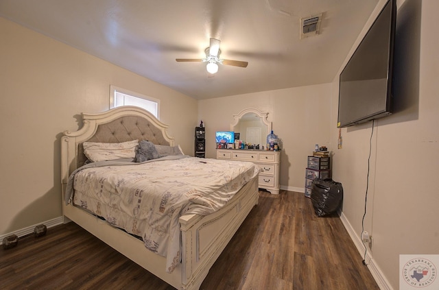 bedroom with ceiling fan and dark hardwood / wood-style flooring