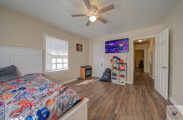 bedroom featuring ceiling fan and hardwood / wood-style flooring