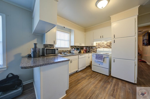 kitchen featuring white appliances, white cabinetry, decorative backsplash, sink, and dark hardwood / wood-style floors