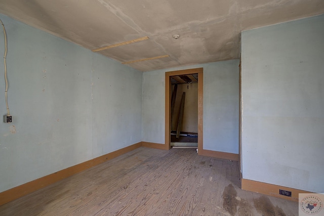 empty room featuring wood-type flooring