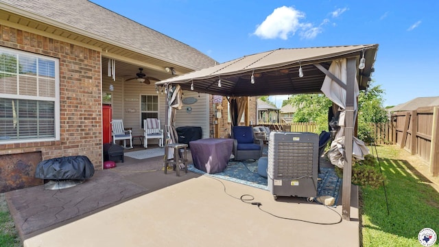 908 Arnold Ln, Texarkana, TX 75503 - fenced backyard with a gazebo, ceiling fan, and a patio