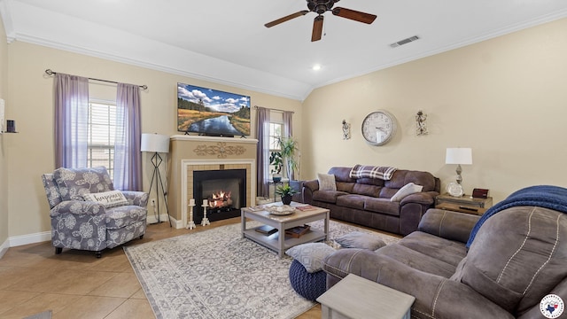 908 Arnold Ln, Texarkana, TX 75503 - living area featuring ceiling fan, ornamental molding, light tile patterned flooring, a tiled fireplace, and recessed lighting