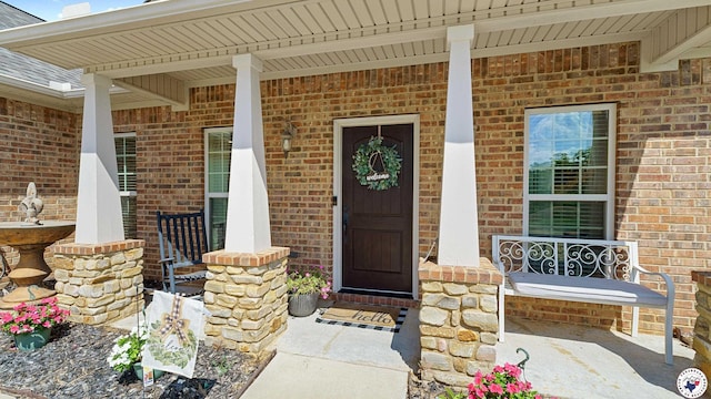 908 Arnold Ln, Texarkana, TX 75503 - property entrance with covered porch and brick siding