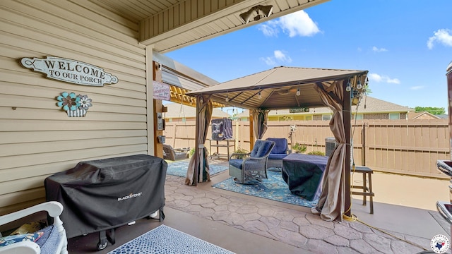 908 Arnold Ln, Texarkana, TX 75503 - fenced backyard with a gazebo, a patio area, and area for grilling