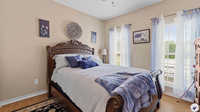 908 Arnold Ln, Texarkana, TX 75503 - bedroom with multiple windows and wood finished floors