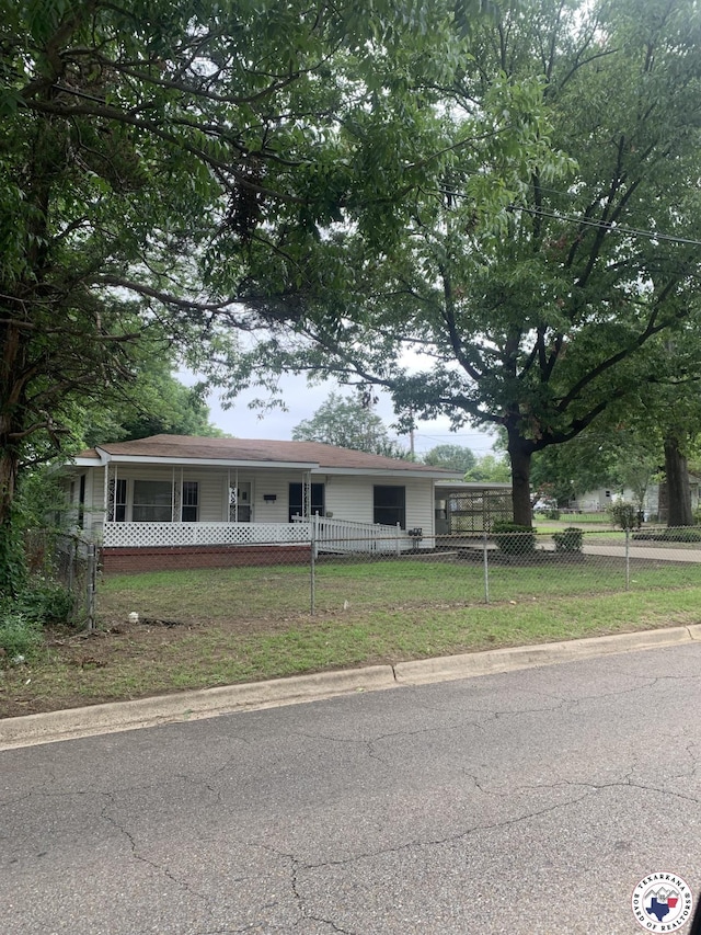 209 E 35th St, Texarkana, AR 71854 - single story home with a fenced front yard