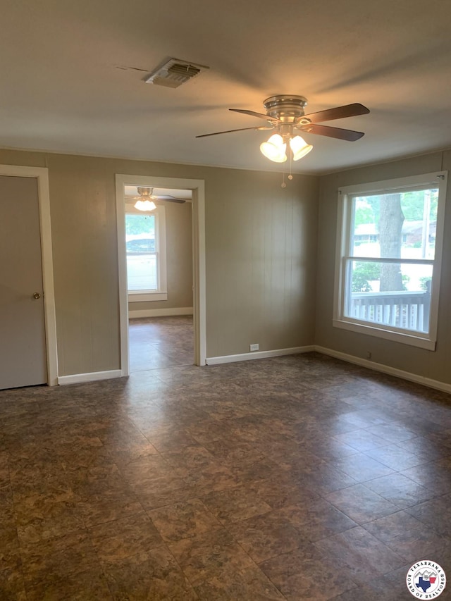 209 E 35th St, Texarkana, AR 71854 - empty room with baseboards and ceiling fan