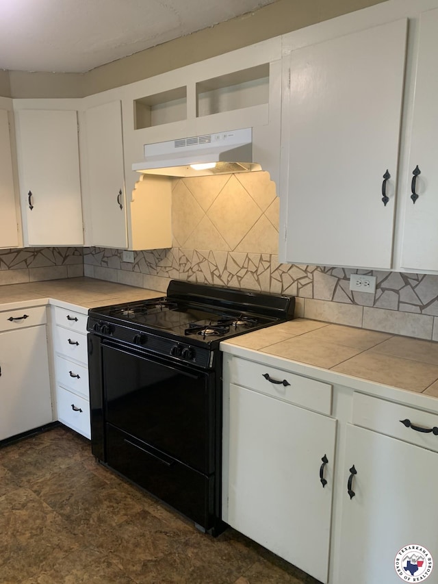 209 E 35th St, Texarkana, AR 71854 - kitchen with black range with gas cooktop, under cabinet range hood, white cabinets, decorative backsplash, and open shelves