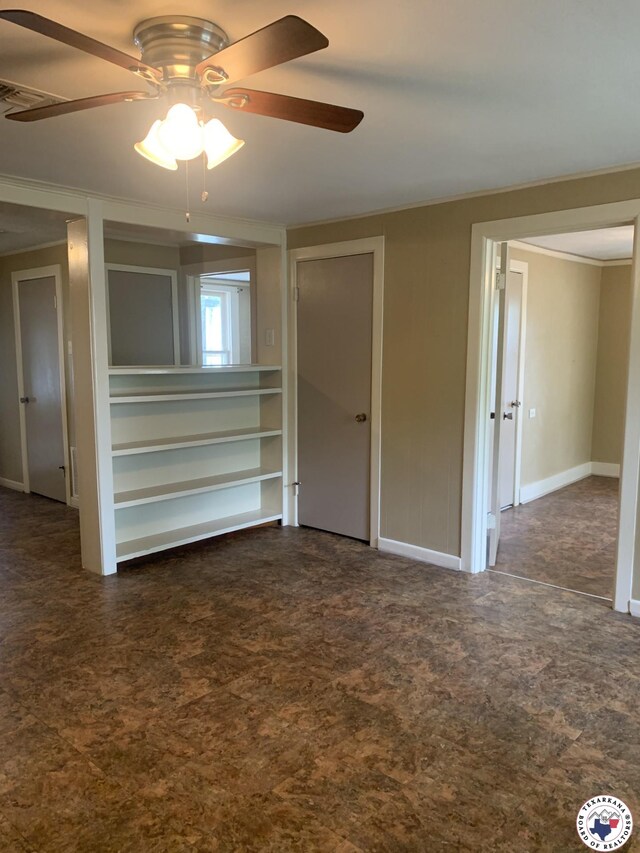 209 E 35th St, Texarkana, AR 71854 - spare room with crown molding and a ceiling fan