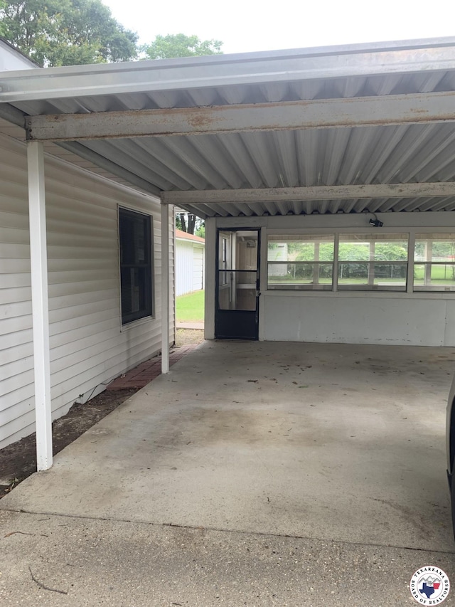 209 E 35th St, Texarkana, AR 71854 - view of vehicle parking featuring an attached carport