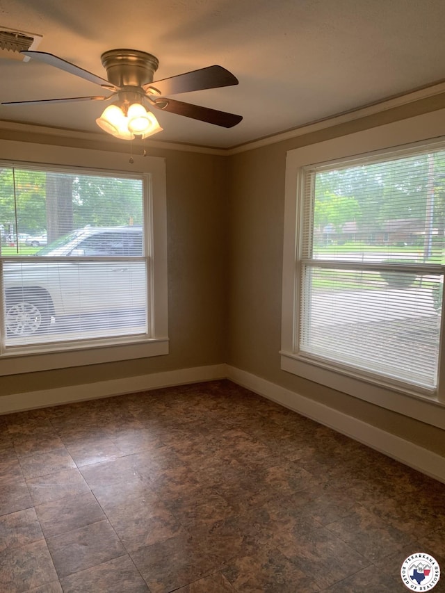 209 E 35th St, Texarkana, AR 71854 - spare room featuring healthy amount of natural light, ceiling fan, and crown molding