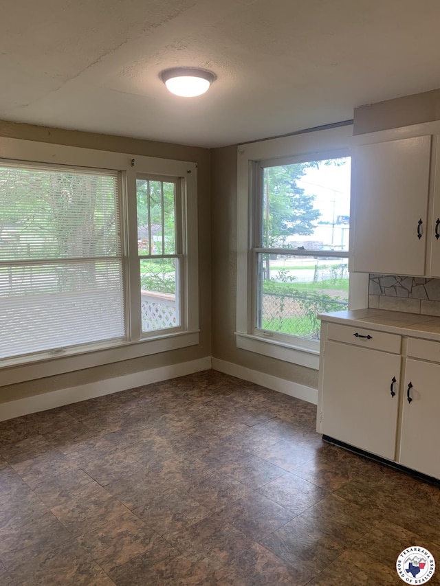 209 E 35th St, Texarkana, AR 71854 - unfurnished dining area with baseboards