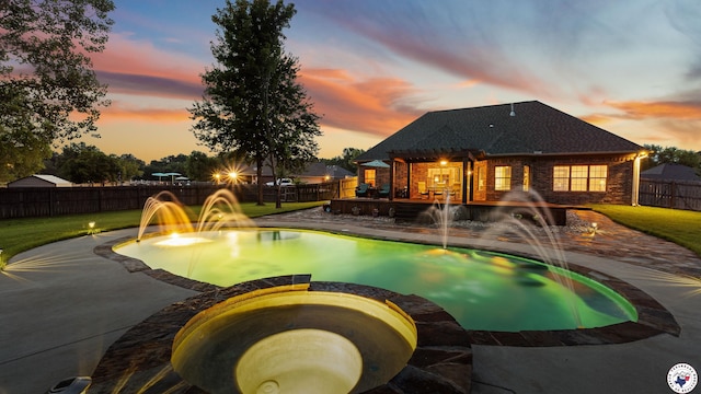 6 Stonewall Cir, Texarkana, TX 75503 - pool at dusk with a pool with connected hot tub, a fenced backyard, and a patio