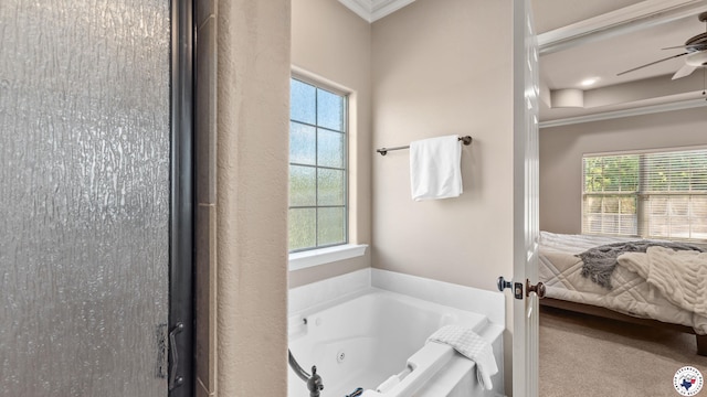 6 Stonewall Cir, Texarkana, TX 75503 - ensuite bathroom with ornamental molding, a tub with jets, and a ceiling fan