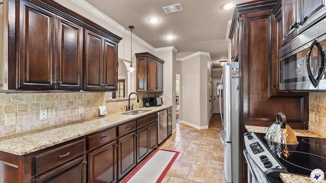 6 Stonewall Cir, Texarkana, TX 75503 - kitchen featuring appliances with stainless steel finishes, dark brown cabinets, ornamental molding, light stone counters, and decorative backsplash
