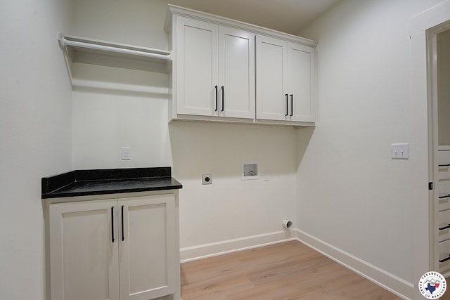 101 Ranch Rd, Texarkana, TX 75503 - laundry area featuring washer hookup, hookup for an electric dryer, cabinet space, baseboards, and light wood-style flooring