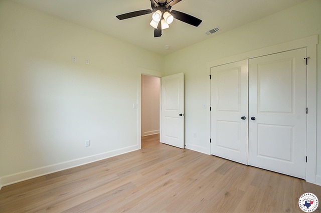 101 Ranch Rd, Texarkana, TX 75503 - unfurnished bedroom featuring light wood-type flooring, baseboards, a closet, and ceiling fan