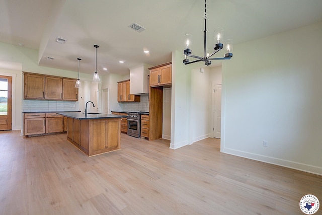101 Ranch Rd, Texarkana, TX 75503 - kitchen with stainless steel stove, dark countertops, brown cabinets, a chandelier, and decorative backsplash