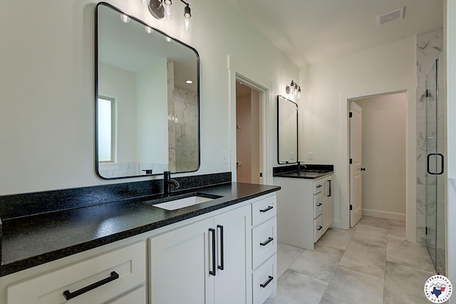 101 Ranch Rd, Texarkana, TX 75503 - full bath with a shower stall, two vanities, and marble look tile flooring