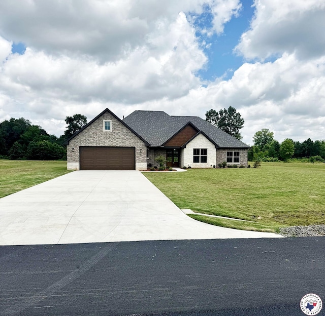 101 Ranch Rd, Texarkana, TX 75503 - view of front of property with an attached garage, driveway, a front yard, and stone siding