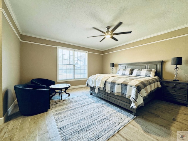 4604 Suzanne Dr, Texarkana, TX 75503 - bedroom featuring baseboards, a textured ceiling, wood finished floors, and crown molding