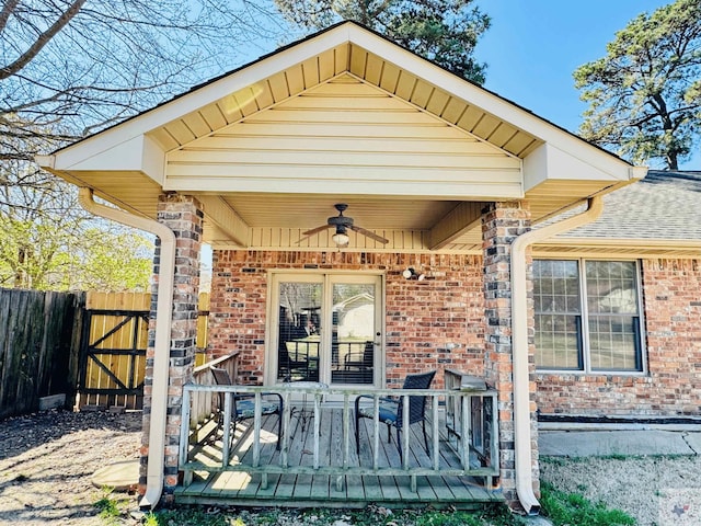 4604 Suzanne Dr, Texarkana, TX 75503 - exterior space with a gate, fence, a wooden deck, ceiling fan, and brick siding
