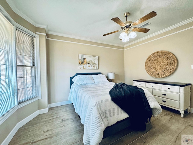 4604 Suzanne Dr, Texarkana, TX 75503 - bedroom featuring baseboards, visible vents, light wood finished floors, ceiling fan, and ornamental molding