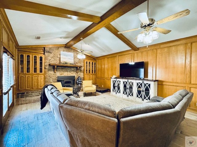 4604 Suzanne Dr, Texarkana, TX 75503 - living room with wooden walls, vaulted ceiling with beams, a ceiling fan, and light wood finished floors