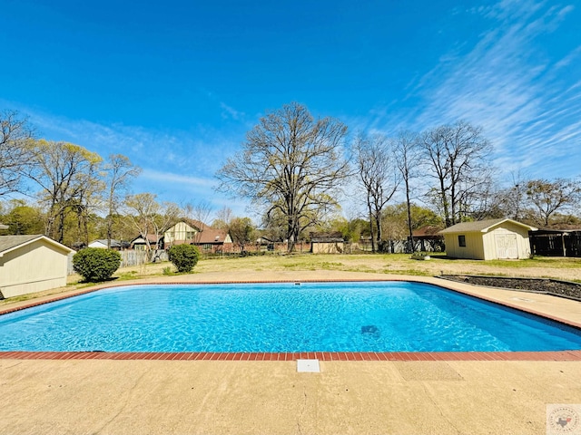 4604 Suzanne Dr, Texarkana, TX 75503 - view of pool with a fenced in pool, an outdoor structure, a storage shed, and a yard