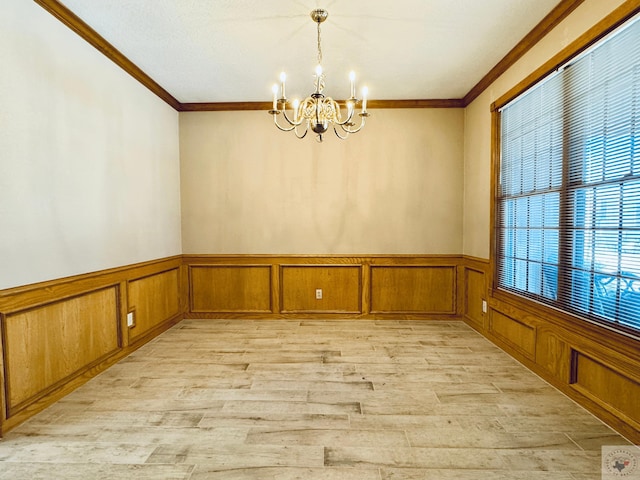 4604 Suzanne Dr, Texarkana, TX 75503 - unfurnished dining area with light wood-type flooring, a notable chandelier, ornamental molding, and wainscoting