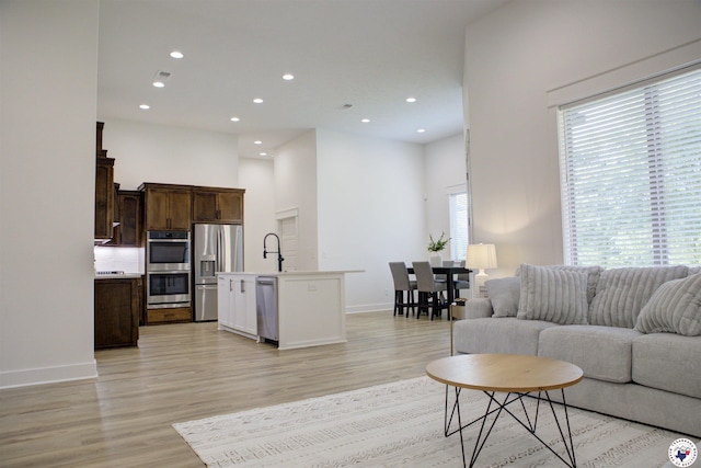 5616 Deaton Pl, Texarkana, TX 75503 - living room with baseboards, light wood finished floors, recessed lighting, and a high ceiling