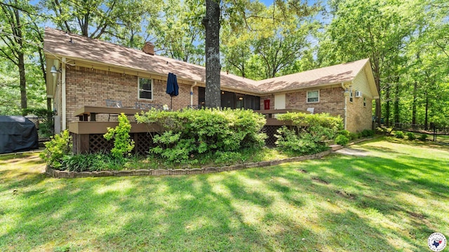 905 Lakeridge Ln, Texarkana, TX 75503 - rear view of house with brick siding, a chimney, and a deck