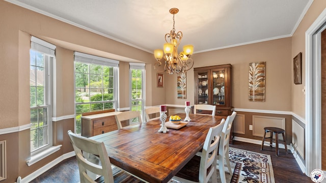 905 Lakeridge Ln, Texarkana, TX 75503 - dining area featuring dark wood finished floors, a chandelier, crown molding, and a wainscoted wall