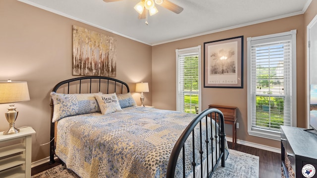 905 Lakeridge Ln, Texarkana, TX 75503 - bedroom featuring multiple windows, dark wood finished floors, crown molding, baseboards, and ceiling fan