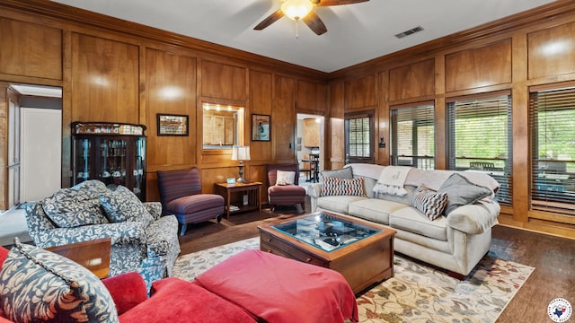 905 Lakeridge Ln, Texarkana, TX 75503 - living room featuring ceiling fan, wood finished floors, wooden walls, and ornamental molding