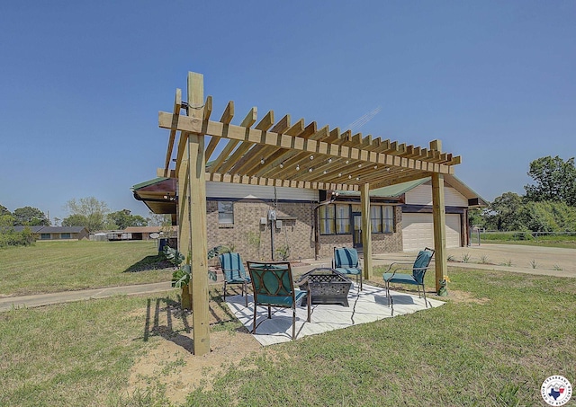 view of patio / terrace with a pergola, an attached garage, an outdoor fire pit, and driveway