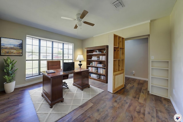 office space featuring dark wood-type flooring, visible vents, baseboards, and ceiling fan