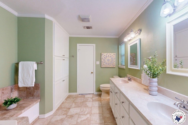 bathroom with crown molding, toilet, visible vents, and a sink