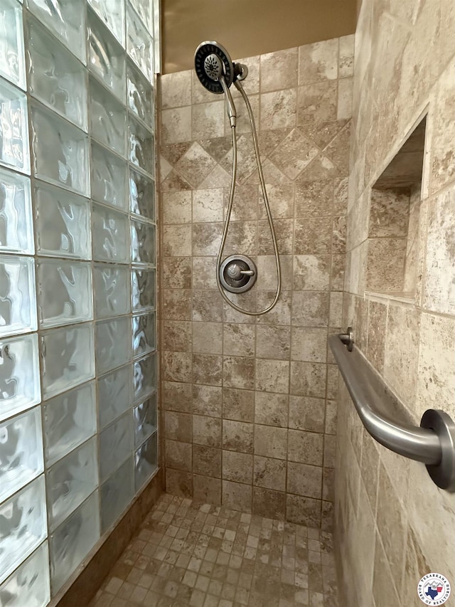 bathroom with tiled shower