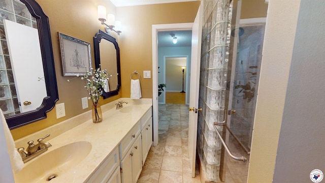 bathroom with a sink, tile patterned flooring, walk in shower, and double vanity