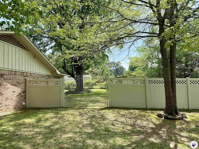 view of yard with a gate and fence