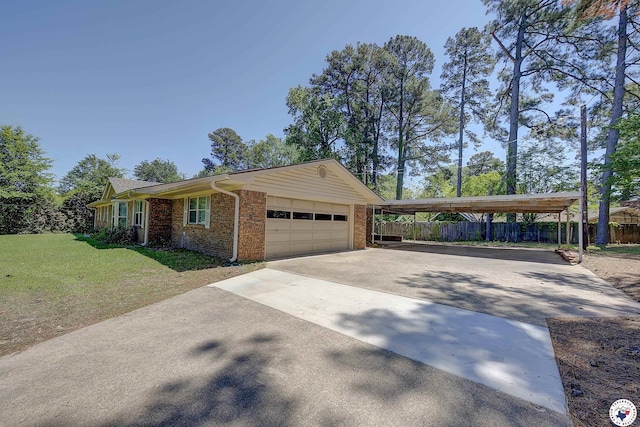 view of side of home featuring fence, brick siding, aphalt driveway, and an attached garage