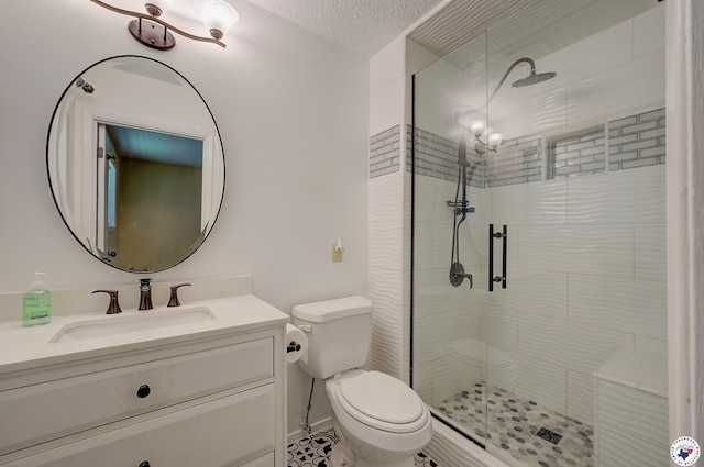 full bath featuring a shower stall, toilet, and vanity